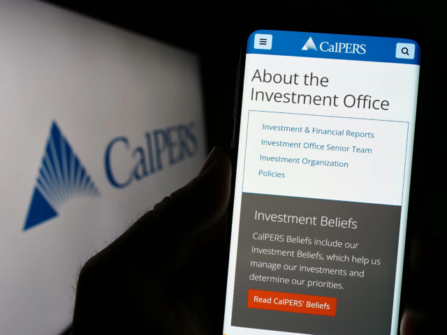 A hand holds a phone displaying the CalPERS investment office webpage, with menu options visible. The blurred CalPERS logo appears in the background on a screen.